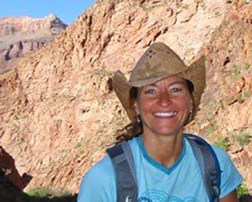 portrait of Shelli Johnson with mountains rocks in the background
